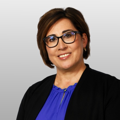 Kathy Ervie, smiling woman with blue blouse and navy blazer